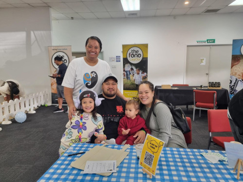 Janet Masoe Hundal, Manager Public Health, with pregnant mama Rosemarie Lui and her family