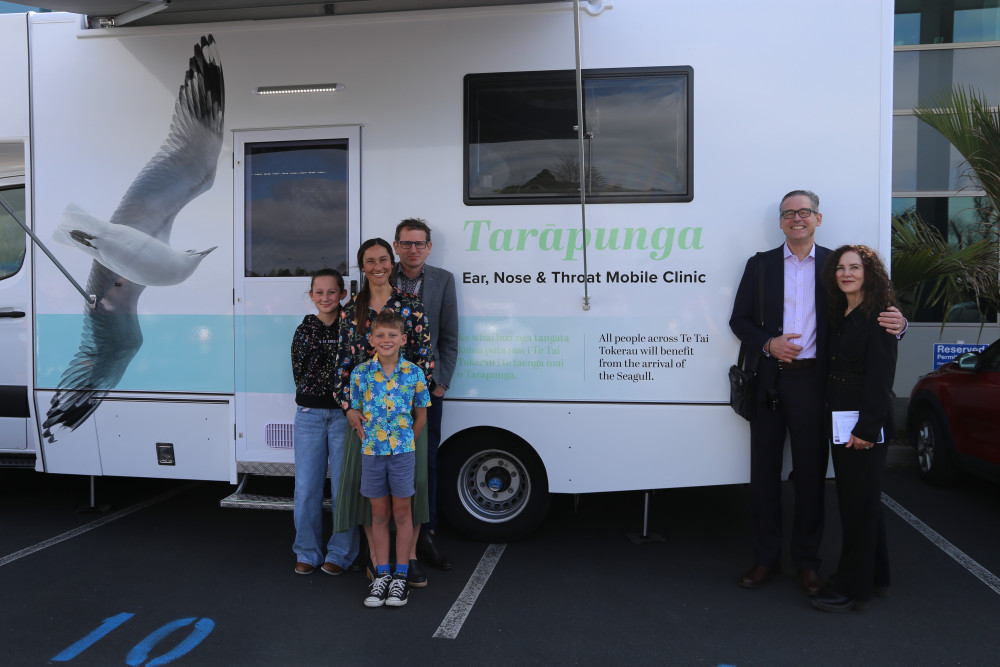 waterhouse family standing outside mobile van