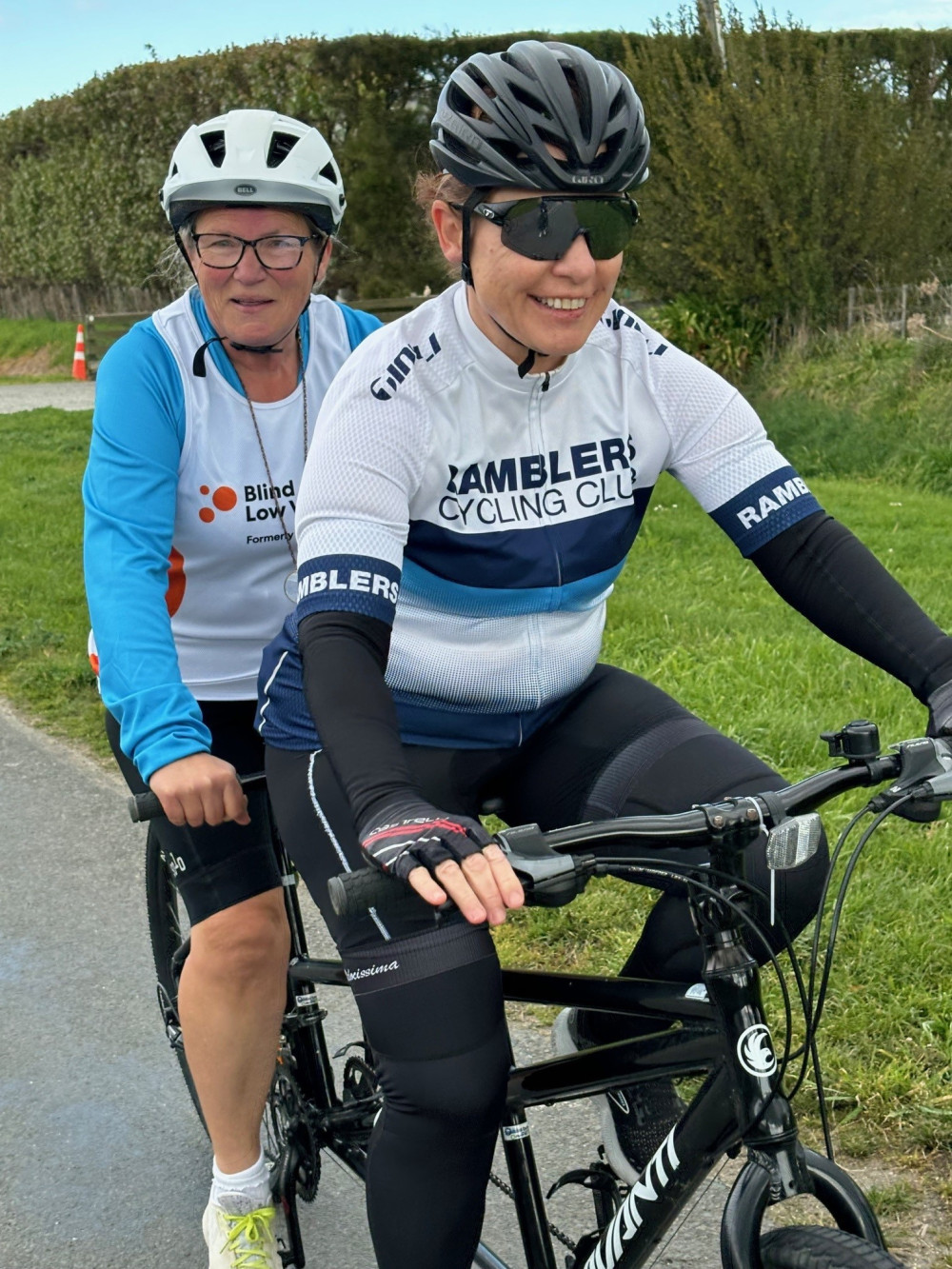 marg port and rachel black riding a tandem bike iat the hawkes bay womens triathlon